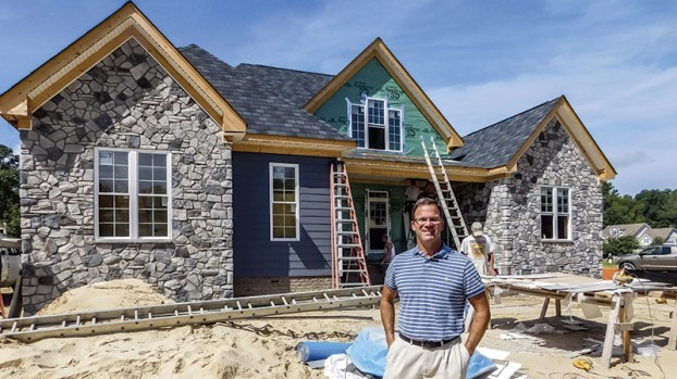 Mark Williams with home under construction